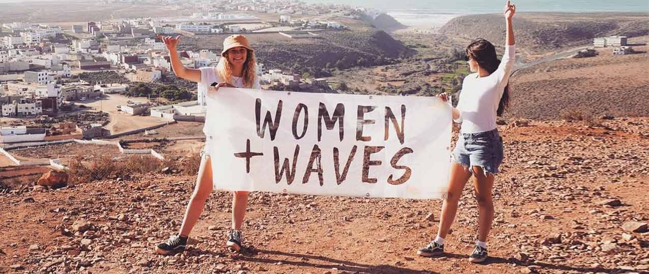 Women And Waves Holding Sign